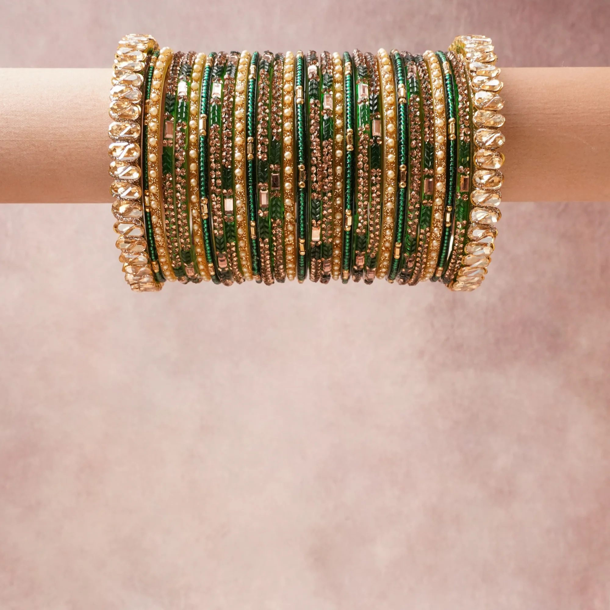 A grounding Emerald Green forms the heart of the set, while touches of Gold, Cream, Clear add charm.

A thoughtful composition of Glass, Gold-toned Metal, Simulated Pearls, Rhinestones, designed to feel complete without being heavy.
Each element layers seamlessly, creating a look that is refined, wearable and quietly striking.